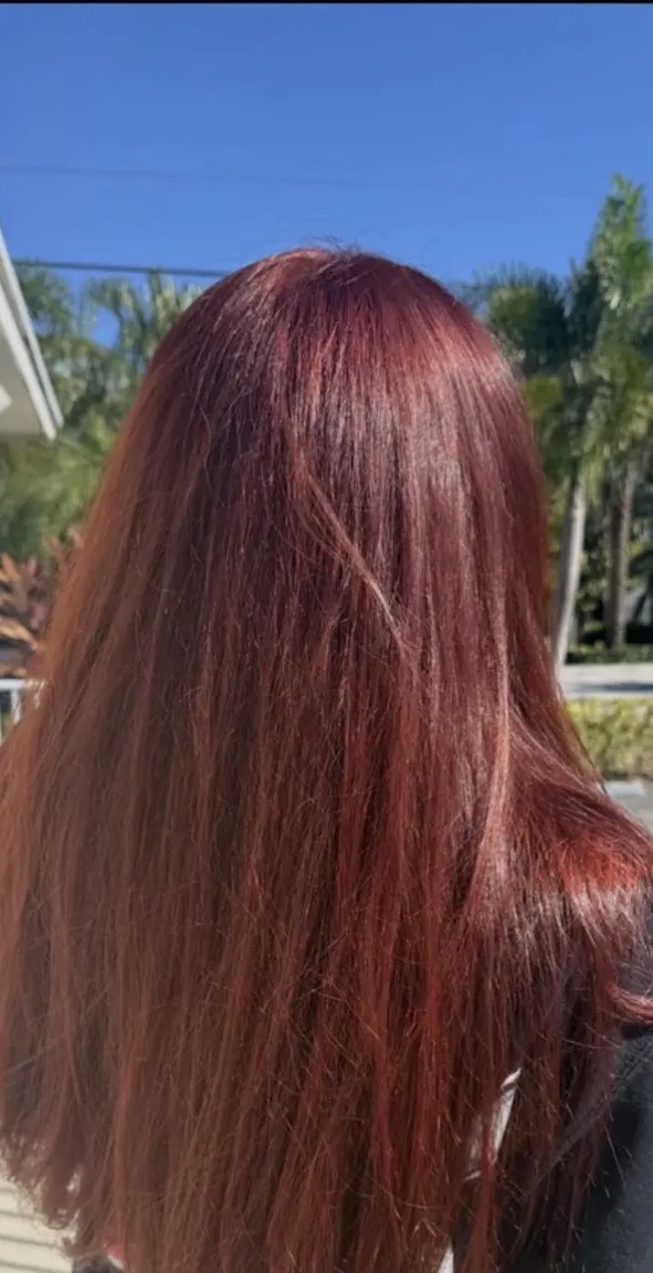 Vibrant copper hair color on a client